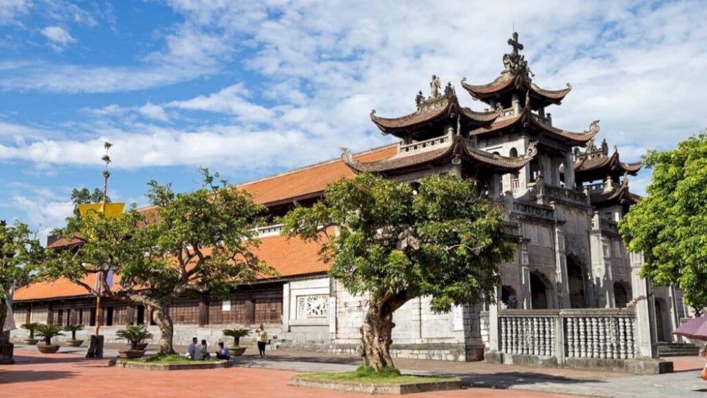 Historic site with vibrant festivals and traditional performances in Phat Diem Cathedral